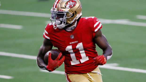 San Francisco 49ers rookie wide receiver Brandon Aiyuk runs with the ball.