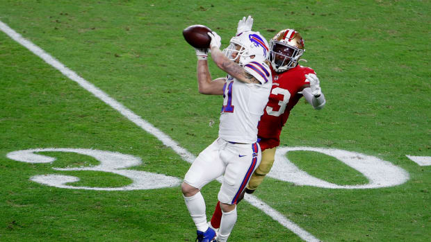 Bills wide receiver Cole Beasley makes a catch in front of a defender.