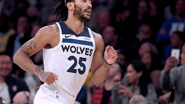 derrick rose runs on the court during a game with the timberwolves