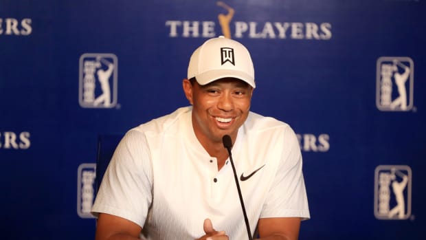 Tiger Woods smiling.