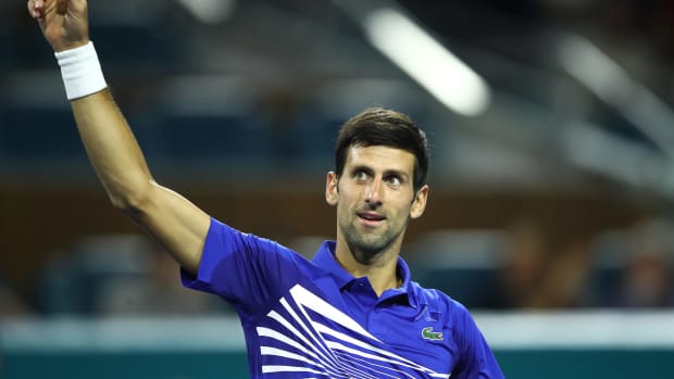 A closeup of Novak Djokovic celebrating his victory.