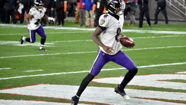Lamar Jackson #8 of the Baltimore Ravens rushes for a touchdown during the first quarter against the Cleveland Browns