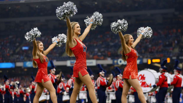 The Ole Miss Rebels cheerleaders perform before the first quarter against the Oklahoma State Cowboys during the Allstate Sugar Bowl.