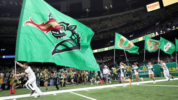 UAB football team takes the field at the Superdome.