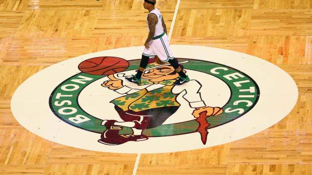 Isaiah Thomas walking across the Boston Celtics court.