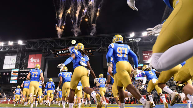 UCLA Bruins takes the field for the Cactus Bowl against the Kansas State Wildcats at Chase Field.