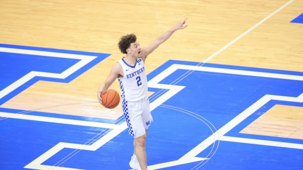 Kentucky guard Devin Askew dribbles up the court.