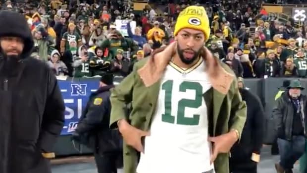 Anthony Davis in an Aaron Rodgers jersey at a Green Bay Packers playoff game.