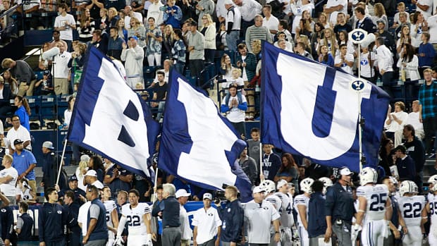 Three flags that spell out B-Y-U at a BYU football game.