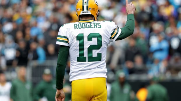 A photo of Green Bay Packers quarterback Aaron Rodgers raising his right pointer finger.