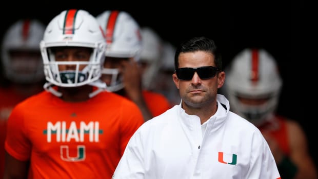 Head coach Manny Diaz of the Miami Hurricanes takes the field