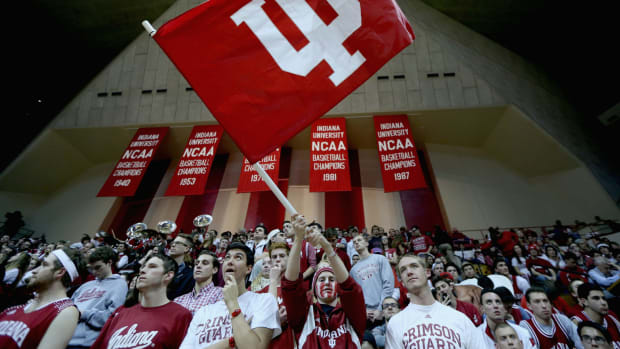 Indiana Hoosiers fans cheering at a basketball game.