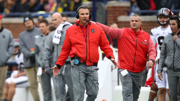 Urban Meyer reacting to a play in an Ohio State football game.