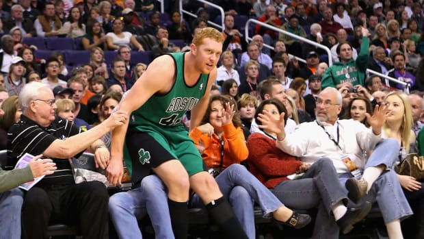 Brian Scalabrine falling into the crowd at a Celtics game.