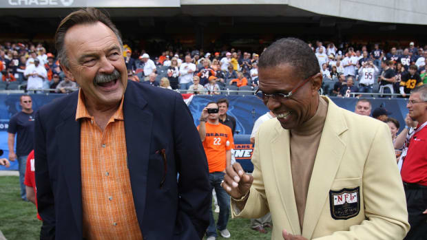 Dick Butkus and Gale Sayers laughing.