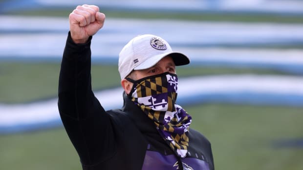 Head coach John Harbaugh of the Baltimore Ravens celebrates following their 20-13 victory over the Tennessee Titans after the AFC Wild Card Playoff game