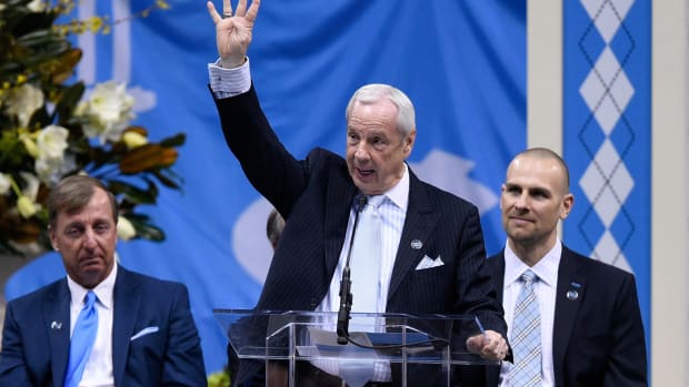 Roy Williams speaking at a memorial service for Dean Smith.