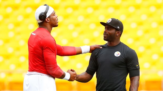 Cam Newton and Michael Vick meet before a game.