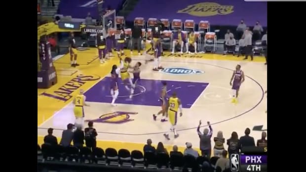 Devin Booker shoves Dennis Schroder during a Lakers vs. Suns playoff game.