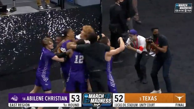 Abilene Christian celebrates a huge upset of Texas basketball at the NCAA Tournament.