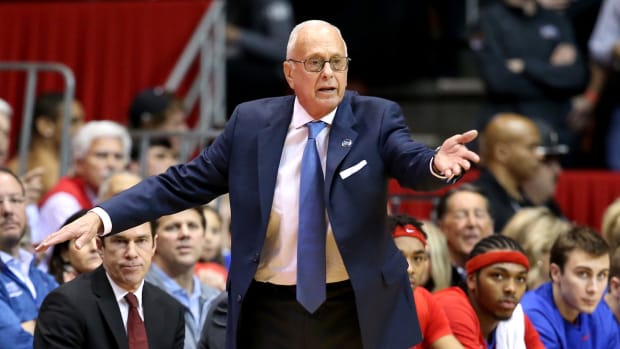 SMU coach Larry Brown reacting to something in the game.
