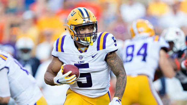 LSU star Derrius Guice carries the ball.
