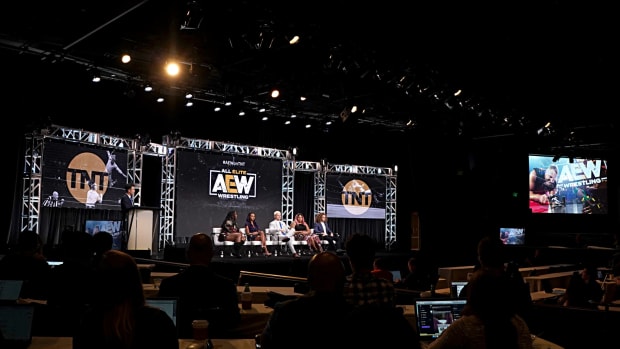 AEW TNT stage with wrestling stars.