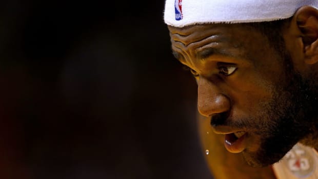 LeBron James sweating in a headband.
