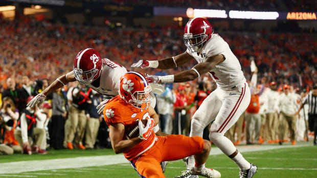 Hunter Renfrow #13 of the Clemson Tigers catches a 31 yard touchdown pass from Deshaun Watson #4 in the first quarter against the Alabama Crimson Tide.