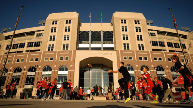 Nebraska fans play football outside Memorial Stadium.