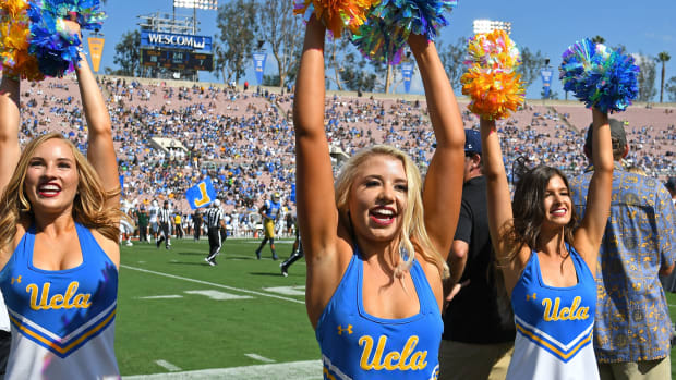 UCLA Bruins cheerleaders entertain the crowd during the game against the Hawaii Warriors at the Rose Bowl.