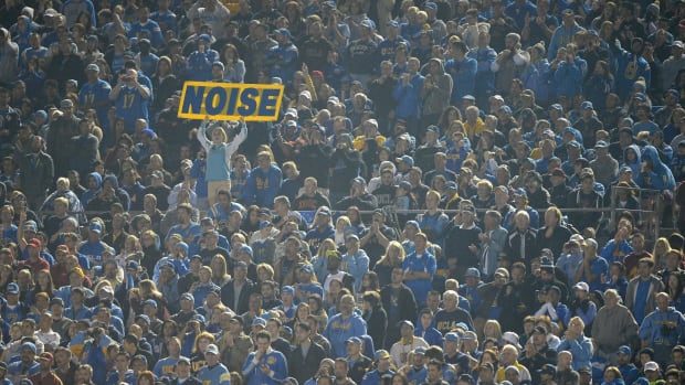 A UCLA Bruins fan holds up a noise sign during a 38-14 win over the USC Trojans at the Rose Bowl.