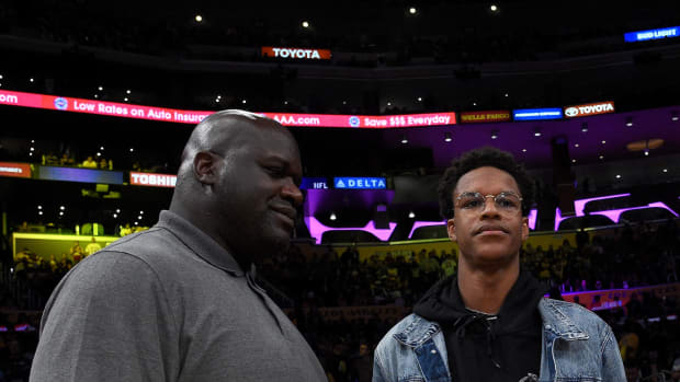 Shaq and his son at the Warriors game.
