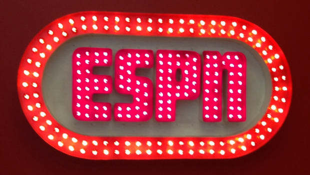 An ESPN sign hanging that's very old