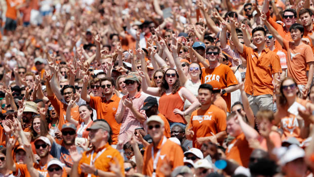 Texas Longhorns fans cheering during a game.