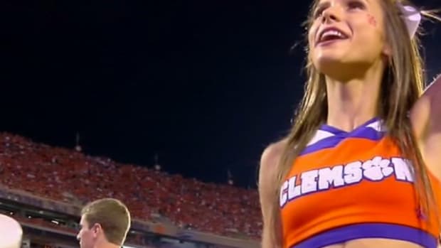 Clemson cheerleader with ridiculous abs.
