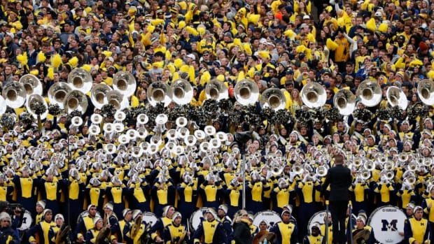 The Michigan Wolverines student section and marching band during the college football game against the Michigan State Spartans.