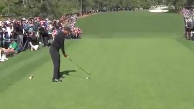 Tiger Woods prepares to take a tee shot at the Masters.