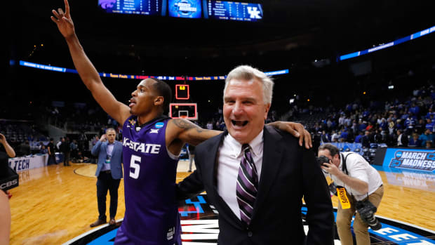 Bruce Weber celebrates with Barry Brown.