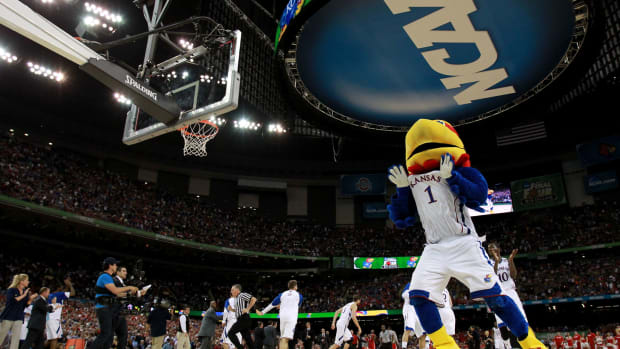 Kansas' mascot celebrating during a basketball game.