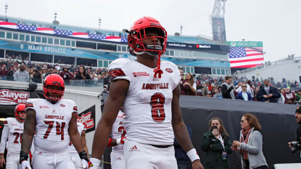 Lamar Jackson takes  the field before a game.