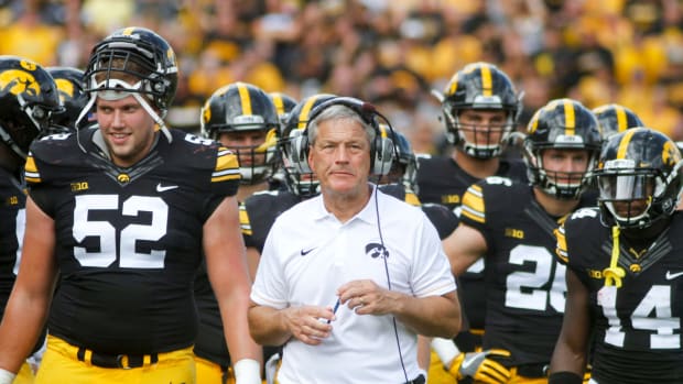Kirk Ferentz on the sideline with his team.