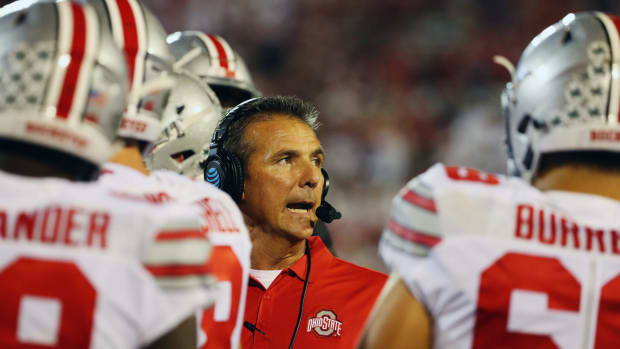 A closeup of Urban Meyer talking to his Ohio State football players.