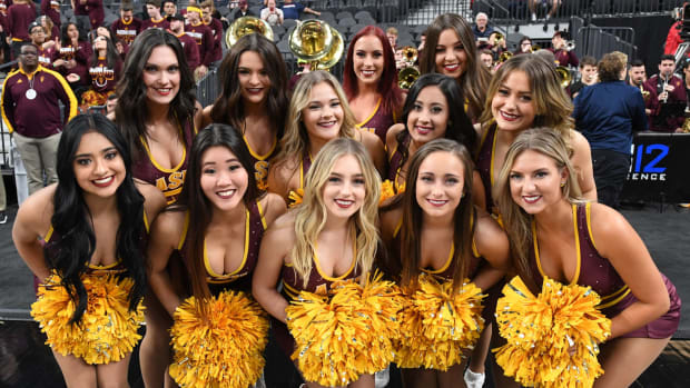 Arizona State Sun Devils cheerleaders pose before the team's first-round game of the Pac-12 basketball tournament against the Colorado Buffaloes at T-Mobile Arena.