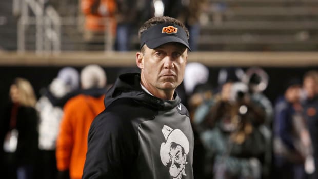 Mike Gundy prepares to coach his team in the Bedlam Game.