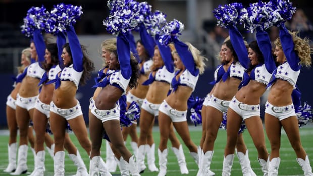 Dallas Cowboys cheerleaders performing during a game.