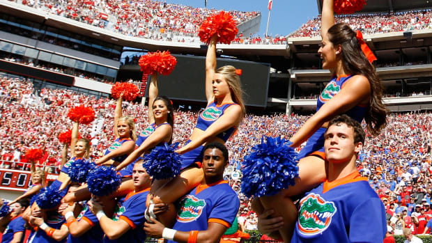 Florida Gators cheerleaders performing during a football game.