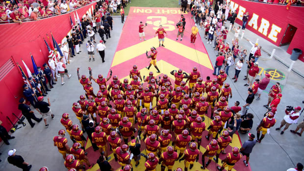 USC Football players walking out of the tunnel.
