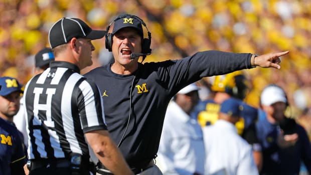 Michigan Wolverines head coach Jim Harbaugh shouts towards an official during the first quarter of the game against the Penn State Nittany Lions.