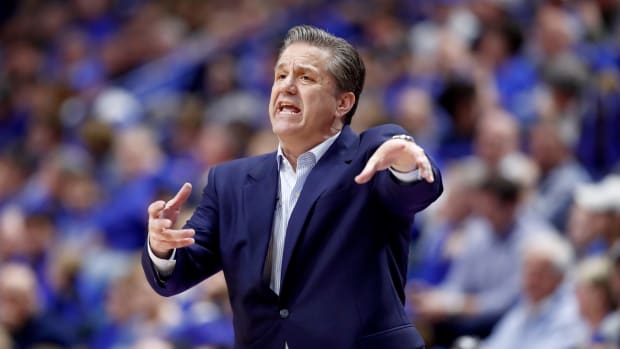 Coach Cal yelling from the Kentucky sideline.